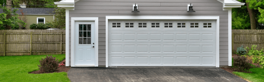 new white traditional garage door with windows